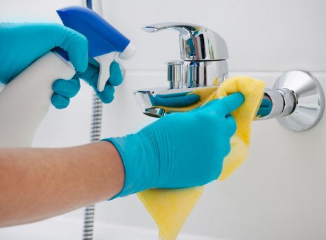 Cleaner working in a high-rise residential home in Canary Wharf